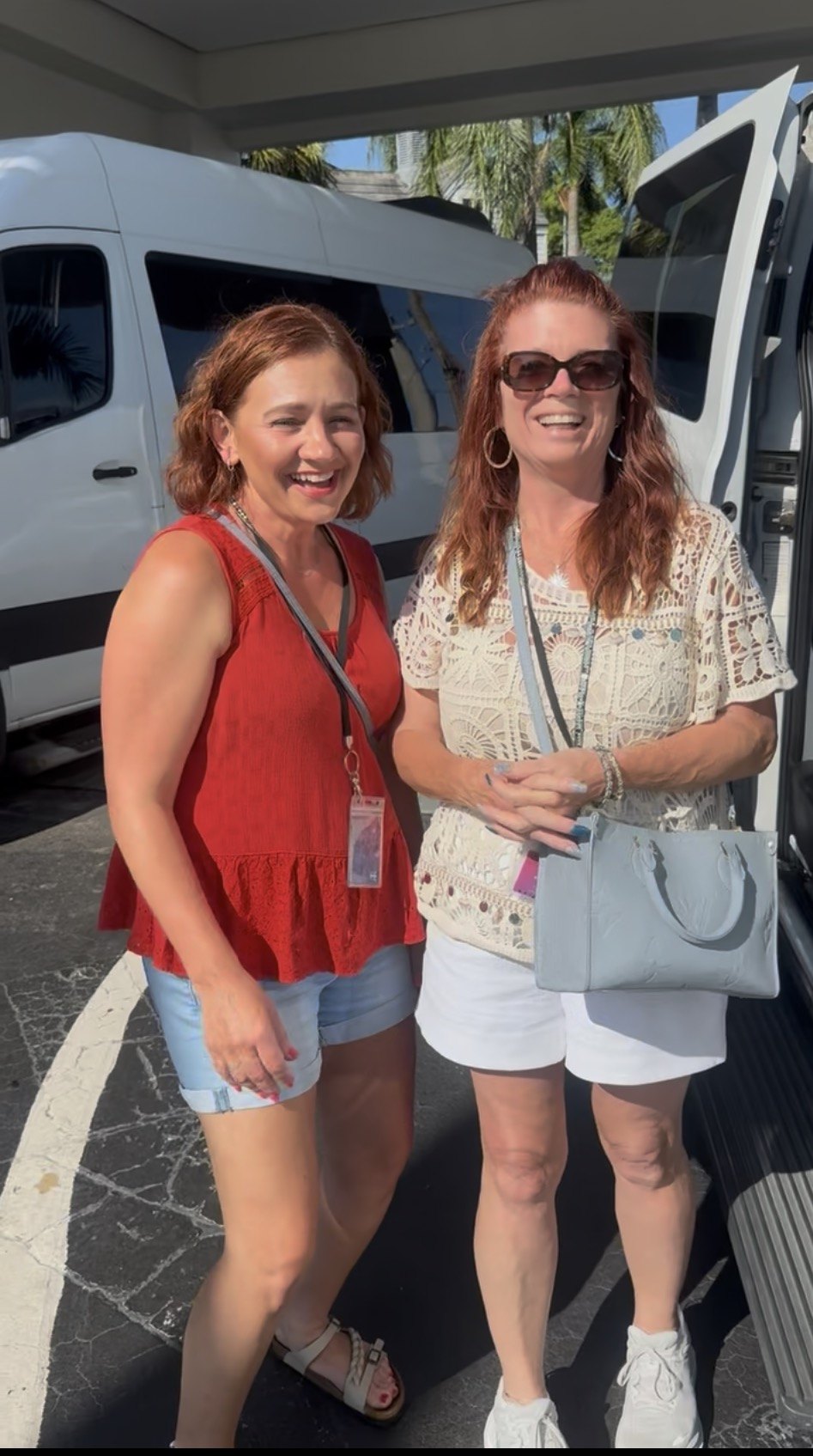 G's Driving Services customers beside passenger van