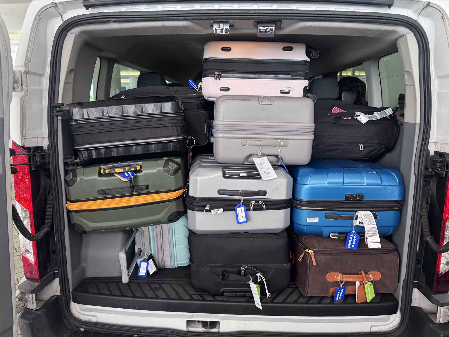 Passenger van packed with cruise luggage